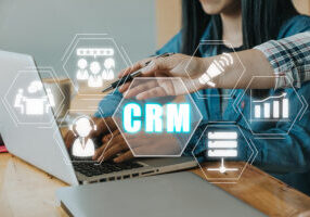 CRM image with people and icons floating around